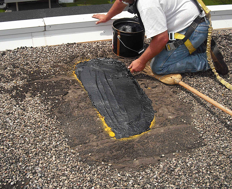 roofing contractor repairing a commercial roof in Port Orchard